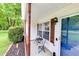 Inviting front porch with a cozy seating area to enjoy the outdoor scenery at 15 Echota Ne Rd, Cartersville, GA 30121