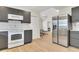 Open-concept kitchen featuring stainless steel appliances and seamless flow to the living area at 15 Echota Ne Rd, Cartersville, GA 30121