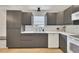 Well-equipped kitchen with gray cabinetry, white countertops, and subway tile backsplash at 15 Echota Ne Rd, Cartersville, GA 30121