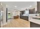 Modern kitchen with stainless steel appliances, gray cabinets, and an adjacent dining area at 15 Echota Ne Rd, Cartersville, GA 30121