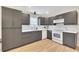 Stylish kitchen with gray cabinets, white appliances, and ample counter space for cooking at 15 Echota Ne Rd, Cartersville, GA 30121
