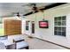 Covered patio offering an outdoor tv, comfortable seating, and a privacy wall for relaxation at 15 Echota Ne Rd, Cartersville, GA 30121