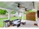 Covered patio featuring comfortable seating, a grill, and a privacy wall for outdoor enjoyment at 15 Echota Ne Rd, Cartersville, GA 30121
