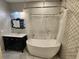 Well-lit bathroom featuring a soaking tub and elegant vanity with mirror at 220 Renaissance Ne Pkwy # 2220, Atlanta, GA 30308