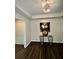 Inviting entryway featuring dark wood floors, stylish lighting, and decorative accents at 220 Renaissance Ne Pkwy # 2220, Atlanta, GA 30308
