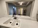 Kitchen featuring a double sink and a window to another room at 220 Renaissance Ne Pkwy # 2220, Atlanta, GA 30308