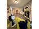 Open concept living room featuring green rug and elegant decor with fireplace at 220 Renaissance Ne Pkwy # 2220, Atlanta, GA 30308