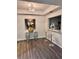Modern living space with bar seating, attractive lighting, and hardwood floors at 220 Renaissance Ne Pkwy # 2220, Atlanta, GA 30308