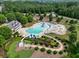 Aerial view of community pool with slides and recreational areas surrounded by lush green landscape at 25 Nunnally Pl, Villa Rica, GA 30180