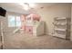 Whimsical bedroom features a castle themed bunk bed, plush carpet, and neutral colored walls at 25 Nunnally Pl, Villa Rica, GA 30180