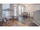 Bright breakfast nook with a view to a fenced yard, with unique table/chairs and hardwood floors at 25 Nunnally Pl, Villa Rica, GA 30180
