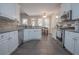 Modern kitchen featuring stainless steel appliances, white cabinets, and a cozy breakfast nook for casual dining at 25 Nunnally Pl, Villa Rica, GA 30180