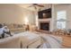 Cozy living room with fireplace, large TV, and comfortable seating creating a relaxing atmosphere at 25 Nunnally Pl, Villa Rica, GA 30180