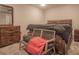 Tranquil main bedroom featuring neutral decor, wooden furniture, and cozy carpeting at 25 Nunnally Pl, Villa Rica, GA 30180