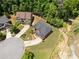 Aerial view of home in cul-de-sac with mature trees and landscaping at 5285 Winflow Way, Suwanee, GA 30024