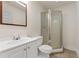Clean bathroom featuring a vanity sink and walk-in shower with glass doors at 5960 Castlegate Dr, Douglasville, GA 30135