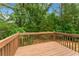 Relaxing deck with lush green scenery, providing a serene outdoor space for nature lovers and relaxation at 5960 Castlegate Dr, Douglasville, GA 30135
