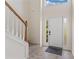 Welcoming entryway featuring a staircase, front door, and tile flooring, creating a warm and inviting atmosphere at 5960 Castlegate Dr, Douglasville, GA 30135