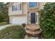 Close-up view of the stone steps leading up to the home's dark-colored front door at 5960 Castlegate Dr, Douglasville, GA 30135