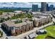 Aerial view of a brick apartment complex with a beautiful skyline view of the city at 400 17Th Nw St # 2308, Atlanta, GA 30363