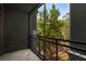 Balcony view showcasing the surrounding greenery, including mature trees that provide natural shade at 400 17Th Nw St # 2308, Atlanta, GA 30363