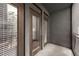 View of the balcony with glass paneled doors and metal railing providing natural light at 400 17Th Nw St # 2308, Atlanta, GA 30363