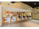 Charming bar area with colorful decor, countertop seating, and a welcoming atmosphere for socializing and refreshments at 400 17Th Nw St # 2308, Atlanta, GA 30363