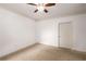 Cozy bedroom features neutral carpet, a ceiling fan and ample natural light at 400 17Th Nw St # 2308, Atlanta, GA 30363