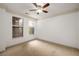 Spacious bedroom features neutral carpet, a ceiling fan and ample natural light at 400 17Th Nw St # 2308, Atlanta, GA 30363