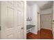 Hallway featuring hardwood floors, doors and a desk area at 400 17Th Nw St # 2308, Atlanta, GA 30363