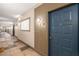 Hallway view leading to an apartment entrance with neutral paint and accent lighting at 400 17Th Nw St # 2308, Atlanta, GA 30363