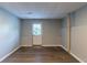 Basement with wood flooring, gray walls, and an access door to the outside at 402 John Tate Nw Rd, Acworth, GA 30102