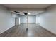A spacious basement with wood floors and exposed utilities and support structure at 402 John Tate Nw Rd, Acworth, GA 30102