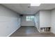 Finished basement with wood flooring, window and access door to the outside at 402 John Tate Nw Rd, Acworth, GA 30102