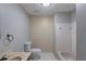 A bathroom with a shower/tub combination and geometric patterned wallpaper and vintage sink at 402 John Tate Nw Rd, Acworth, GA 30102