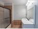 A bathroom with a glass enclosed shower and a double sink vanity offering functionality at 402 John Tate Nw Rd, Acworth, GA 30102