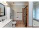 Ensuite bathroom with tiled shower, tub, double sink and modern vanity awaiting your design at 402 John Tate Nw Rd, Acworth, GA 30102