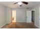 Vacant bedroom featuring two doorways, a ceiling fan and beige carpet, creating a blank canvas at 402 John Tate Nw Rd, Acworth, GA 30102