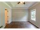 Primary bedroom featuring hardwood floors, crown molding and ensuite bathroom awaiting your design at 402 John Tate Nw Rd, Acworth, GA 30102