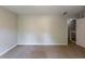 A vacant bedroom featuring neutral walls, carpet floors, and a doorway with white trim at 402 John Tate Nw Rd, Acworth, GA 30102