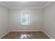 Compact bedroom featuring a window, neutral paint, and carpet at 402 John Tate Nw Rd, Acworth, GA 30102