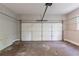 A standard two car garage with a dirty and stained concrete floor at 402 John Tate Nw Rd, Acworth, GA 30102