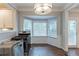Bright kitchen features a bay window with ample light, and classic hardwood floors at 402 John Tate Nw Rd, Acworth, GA 30102