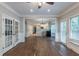 Open floor plan with hardwood floors connecting the living room and kitchen with lots of light at 402 John Tate Nw Rd, Acworth, GA 30102