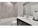 Clean bathroom features a shower-tub combo and tile flooring at 545 Hanlon Way, Alpharetta, GA 30009