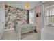 Charming bedroom features a gold bed frame, floral accent wall, and plush, neutral carpeting at 545 Hanlon Way, Alpharetta, GA 30009
