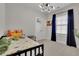 This room includes a basketball hoop, unique light fixture and dark blue curtains at 545 Hanlon Way, Alpharetta, GA 30009