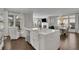 Bright, airy kitchen with an island, stainless steel appliances and large windows allowing for natural light at 545 Hanlon Way, Alpharetta, GA 30009