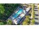 Aerial view of a community pool surrounded by tall green trees and lounge chairs at 545 Hanlon Way, Alpharetta, GA 30009