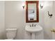 Traditional half bath features pedestal sink, classic fixtures, and wall sconces at , Dunwoody, GA 30338